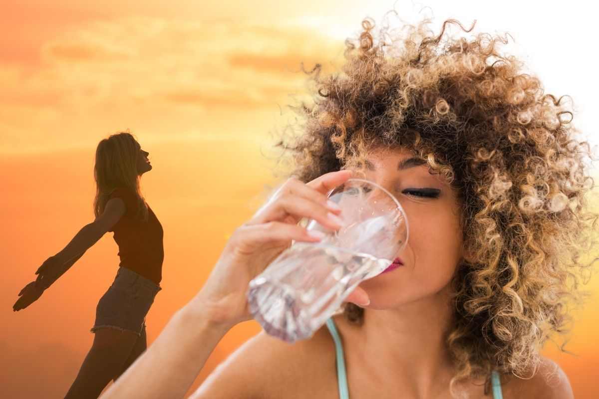 Ragazza beve bicchiere di acqua